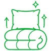 Green line drawing of a pillow and folded blanket with sparkle symbols, indicating cleanliness or freshness.